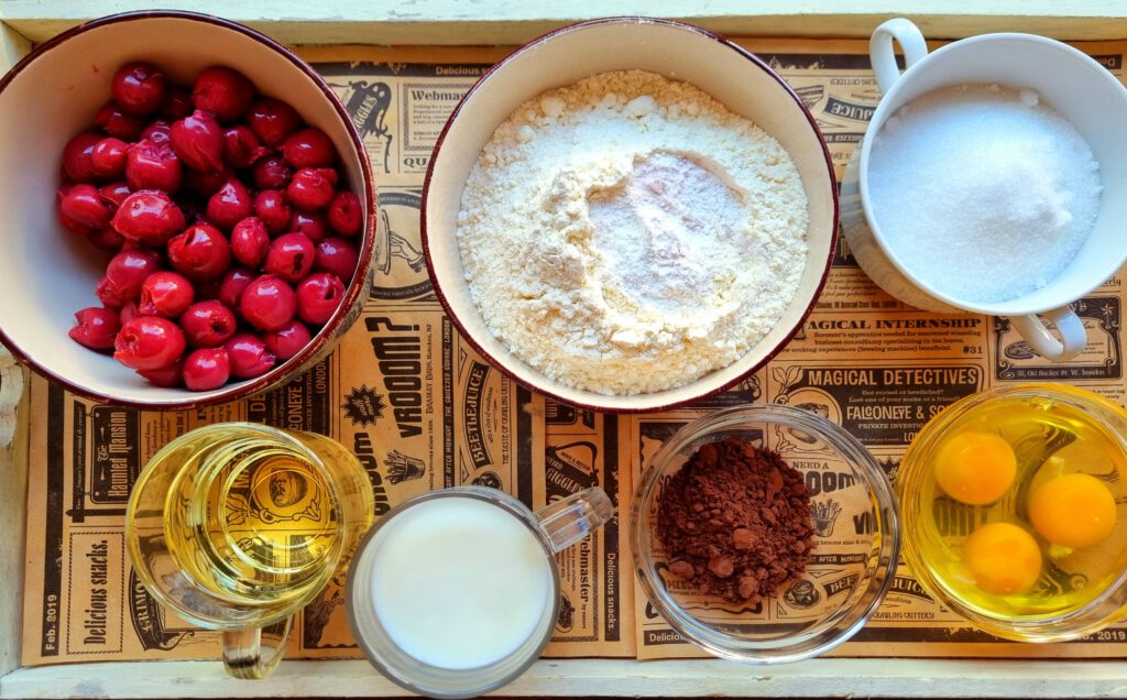 Zutaten für den Rührteig von Donauwelle: Öl, Milch, eier, Zucker, Mehl, Kakao, Kirschen